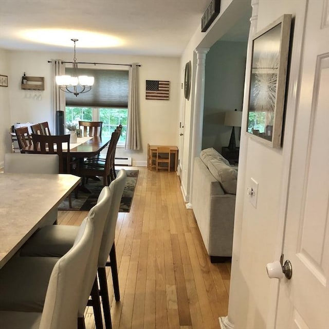 216 Fairbanks St, West Boylston, MA 01583 - dining area featuring light wood finished floors and a chandelier