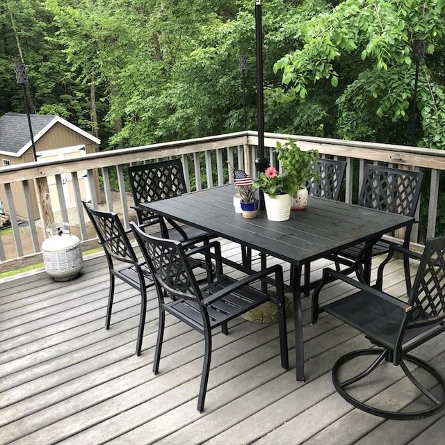 216 Fairbanks St, West Boylston, MA 01583 - wooden deck featuring outdoor dining space and an outdoor structure
