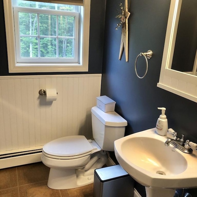 216 Fairbanks St, West Boylston, MA 01583 - half bathroom with baseboard heating, wainscoting, and tile patterned flooring