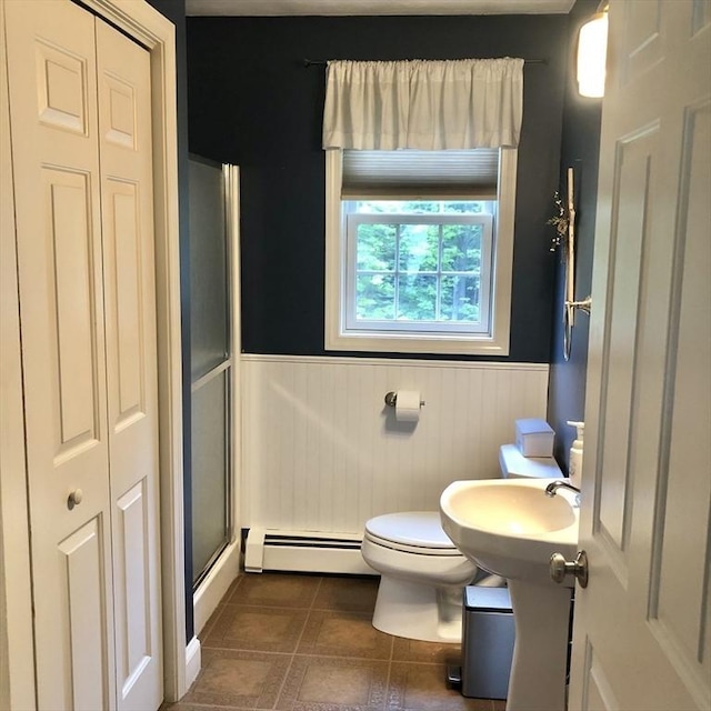 216 Fairbanks St, West Boylston, MA 01583 - full bathroom with baseboard heating, wainscoting, a shower with door, tile patterned flooring, and a closet