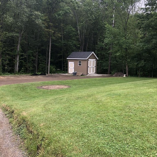 216 Fairbanks St, West Boylston, MA 01583 - view of green lawn with a storage unit and a view of trees
