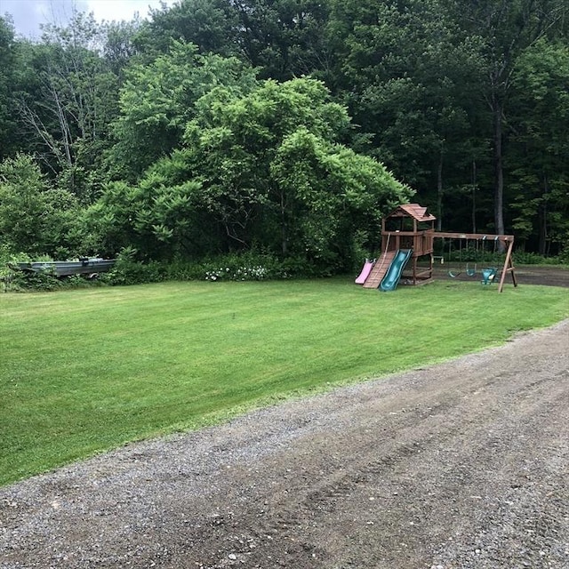 216 Fairbanks St, West Boylston, MA 01583 - view of green lawn featuring a playground and a view of trees