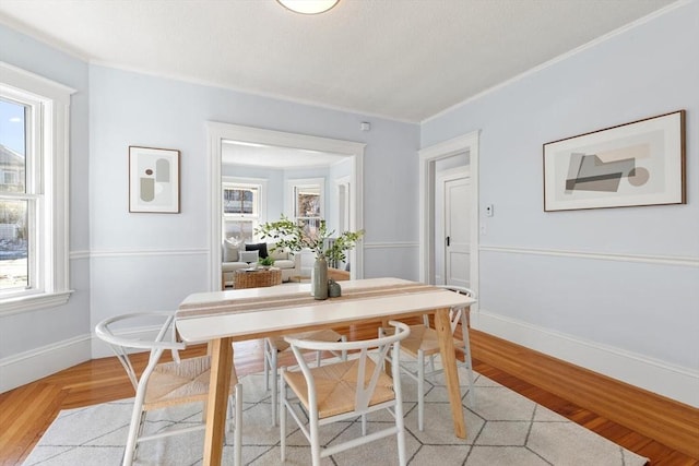 dining area with light parquet flooring