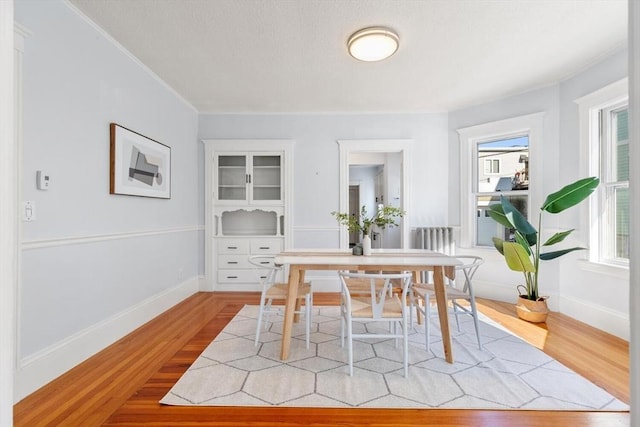 dining space featuring light wood-type flooring