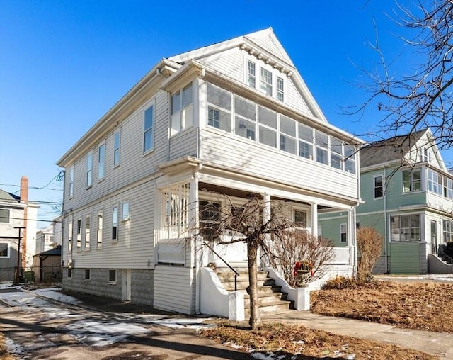 view of front of property with a sunroom