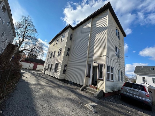 view of side of property featuring a garage