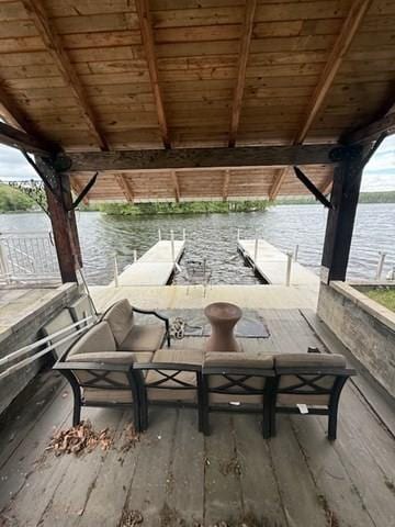 45 Spring St, Lunenburg, MA 01462 - view of patio with boat lift, a boat dock, and a water view