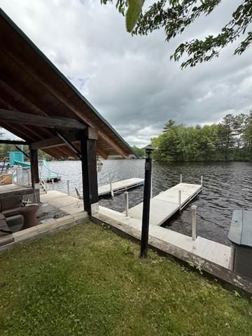 45 Spring St, Lunenburg, MA 01462 - view of patio / terrace with a dock and a water view