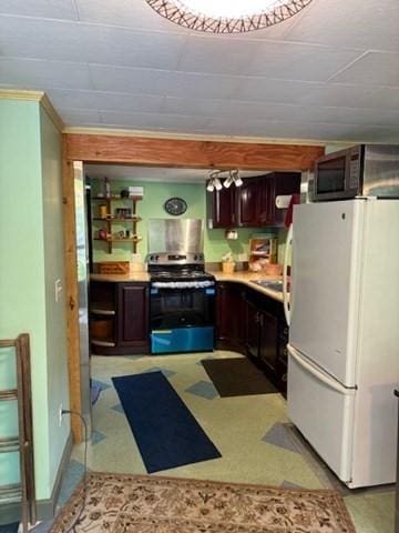 45 Spring St, Lunenburg, MA 01462 - kitchen featuring stainless steel appliances, light countertops, and dark brown cabinets