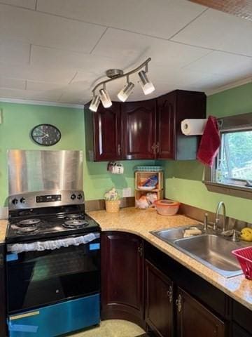 45 Spring St, Lunenburg, MA 01462 - kitchen featuring stainless steel range with electric cooktop, a sink, light countertops, and ornamental molding