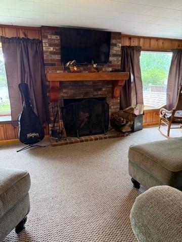 45 Spring St, Lunenburg, MA 01462 - carpeted living area featuring wooden walls and a brick fireplace