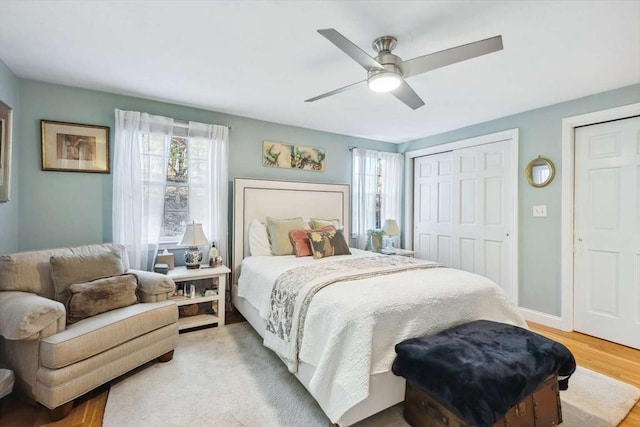 bedroom with ceiling fan and wood-type flooring