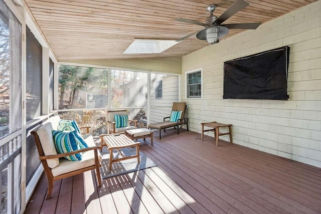 sunroom featuring ceiling fan, wooden ceiling, and vaulted ceiling