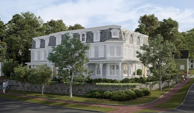 view of front of home with mansard roof