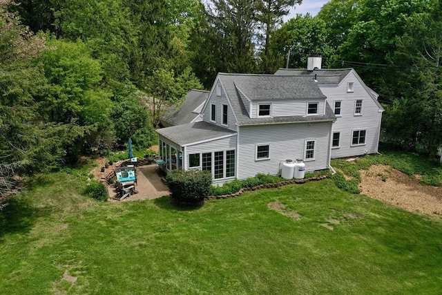 231 Larch Row, Wenham, MA 01984 - back of house with a patio area, a shingled roof, a lawn, and a chimney