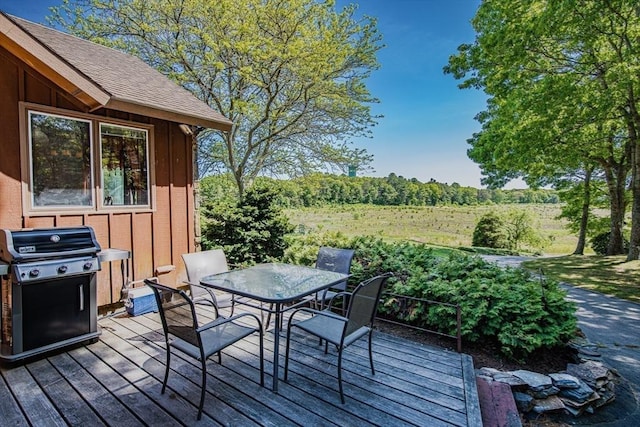 wooden terrace featuring area for grilling