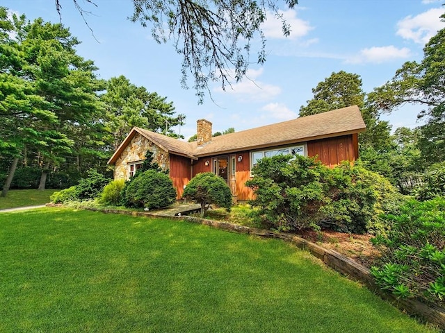 ranch-style house with a front yard