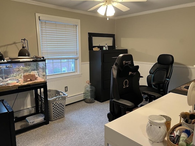 home office featuring carpet floors, a ceiling fan, crown molding, a wainscoted wall, and a baseboard radiator