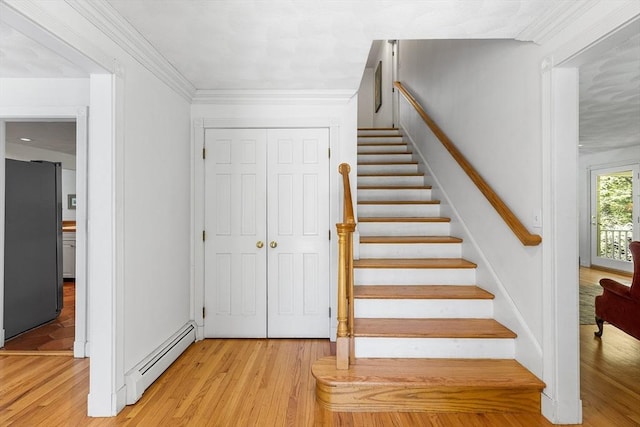160 Woodland Mead, Hamilton, MA 01982 - staircase featuring a baseboard radiator and wood finished floors