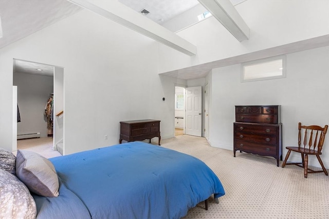 160 Woodland Mead, Hamilton, MA 01982 - bedroom with a baseboard heating unit, light colored carpet, beam ceiling, a walk in closet, and baseboards