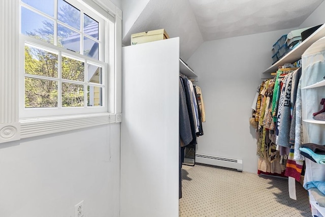 160 Woodland Mead, Hamilton, MA 01982 - spacious closet with baseboard heating, carpet flooring, and vaulted ceiling
