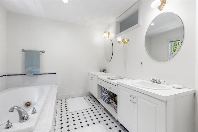 160 Woodland Mead, Hamilton, MA 01982 - bathroom with double vanity, a jetted tub, tile patterned flooring, and baseboards