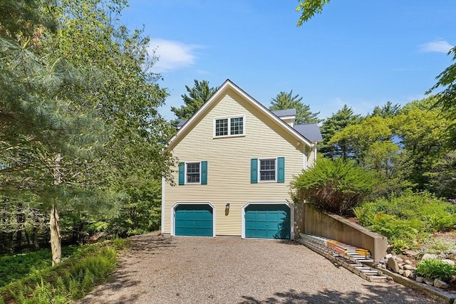 160 Woodland Mead, Hamilton, MA 01982 - view of front facade with gravel driveway and an attached garage