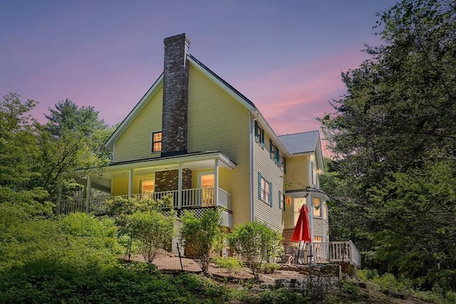160 Woodland Mead, Hamilton, MA 01982 - back of house featuring a chimney and a porch