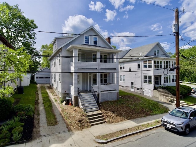 144 Webster St, Arlington, MA 02474 - view of front of home featuring a balcony, stairway, a porch, and a garage