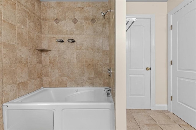 bathroom with tiled shower / bath and tile patterned floors