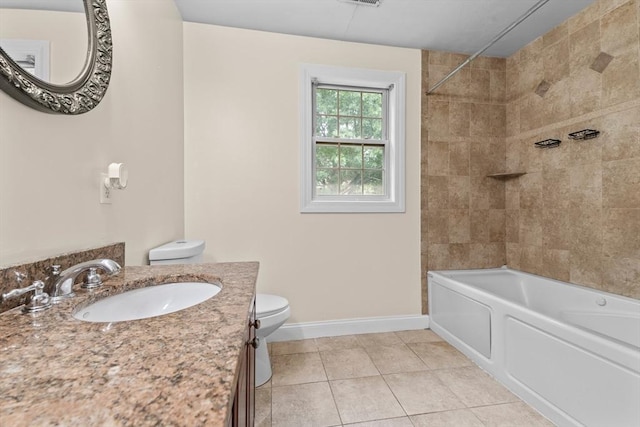 full bathroom featuring vanity, tile patterned floors, toilet, and tiled shower / bath