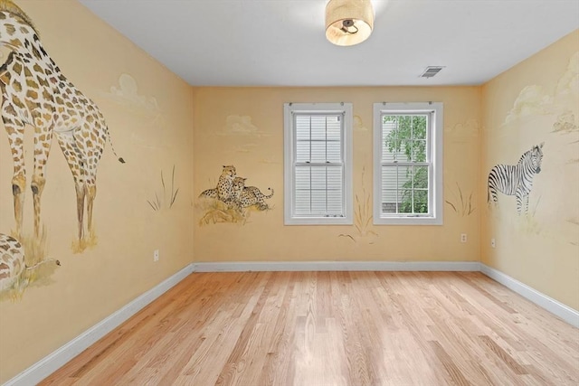 unfurnished room featuring wood-type flooring