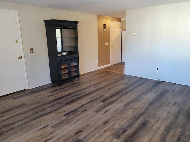 unfurnished living room featuring dark hardwood / wood-style floors