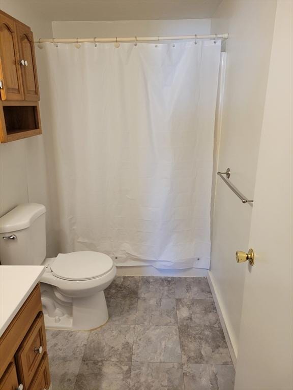 full bathroom featuring vanity, toilet, and shower / bath combo with shower curtain