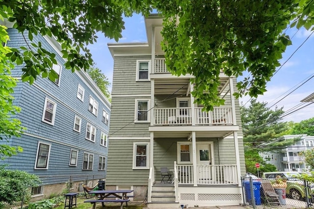 111 Williams St Unit 1, Boston, MA 02130 - rear view of house featuring a balcony and a porch