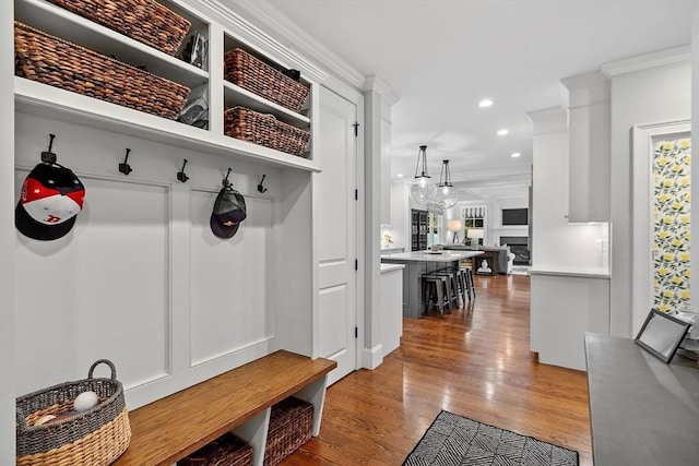 159 Marked Tree Rd, Needham, MA 02492 - mudroom with crown molding, wood finished floors, and recessed lighting