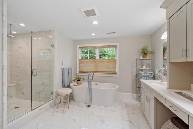159 Marked Tree Rd, Needham, MA 02492 - bathroom featuring a stall shower, vanity, a freestanding tub, recessed lighting, and marble finish floors