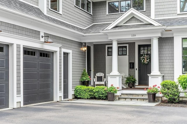 159 Marked Tree Rd, Needham, MA 02492 - doorway to property with a garage, covered porch, and roof with shingles