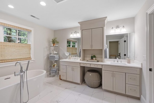 159 Marked Tree Rd, Needham, MA 02492 - full bathroom with double vanity, a freestanding bath, marble finish floors, and recessed lighting