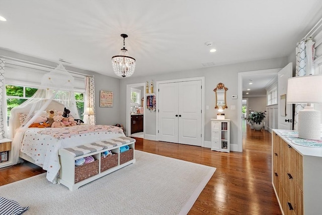 159 Marked Tree Rd, Needham, MA 02492 - bedroom featuring multiple windows, a chandelier, wood finished floors, and recessed lighting