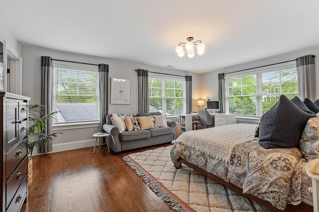 159 Marked Tree Rd, Needham, MA 02492 - bedroom with multiple windows, wood finished floors, baseboards, and a chandelier