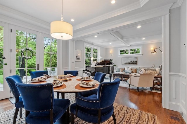 159 Marked Tree Rd, Needham, MA 02492 - dining room featuring a decorative wall, crown molding, and wood finished floors