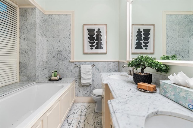 8 Garrison St Unit 104, Boston, MA 02116 - bathroom featuring a bath, toilet, double vanity, marble finish flooring, and tile walls