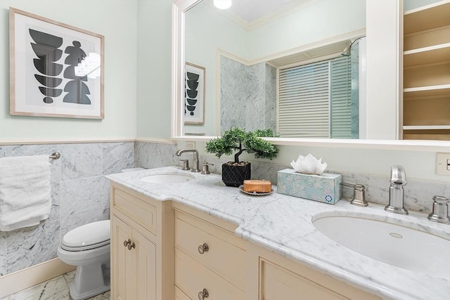 8 Garrison St Unit 104, Boston, MA 02116 - full bath featuring double vanity, crown molding, toilet, marble finish flooring, and a wainscoted wall