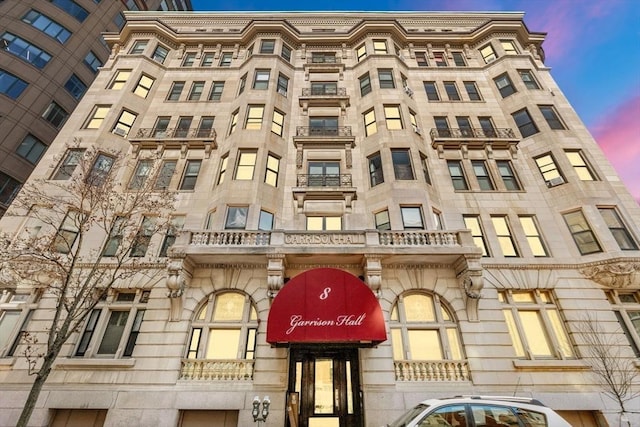 8 Garrison St Unit 104, Boston, MA 02116 - property at dusk featuring a view of apartment building / complex