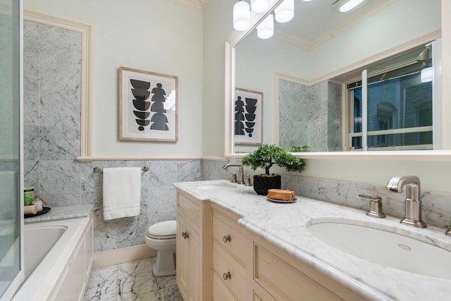 bathroom featuring vanity, tile walls, ornamental molding, a bathtub, and toilet