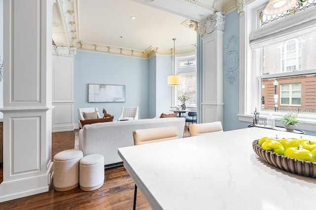 8 Garrison St Unit 104, Boston, MA 02116 - dining room featuring dark wood-type flooring, plenty of natural light, decorative columns, and crown molding