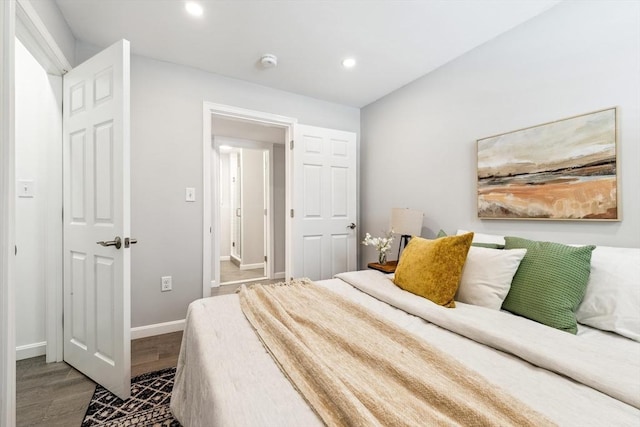 bedroom with hardwood / wood-style floors