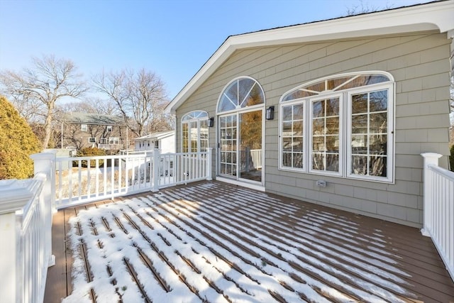 view of snow covered deck