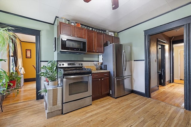 85 Pinehurst Ave, Auburn, MA 01501 - kitchen with stainless steel appliances, light wood finished floors, ceiling fan, baseboards, and ornamental molding